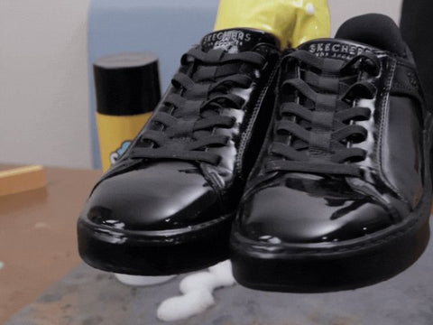 The same sneakers clean after foam and brush