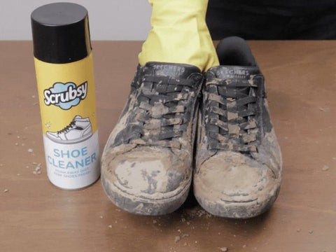 Muddy sneakers next to a can of Scrubsy Shoe Cleaner