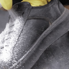Shoe Cleaner foam sprayed on a black sneaker